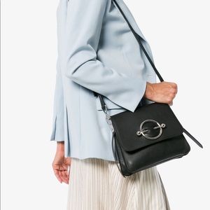JW ANDERSON black disc leather cross body bag